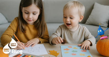 Zwei Kinder sitzen am Tisch und malen bzw. basteln gemeinsam – kreative Herbstaktivitäten für Kinder zuhause.